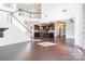Open floorplan featuring hardwood floors, stairs, and a chef's kitchen with large kitchen island at 2243 Creek View Ct, Indian Land, SC 29707