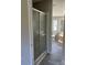 A modern bathroom featuring a glass-enclosed shower and a luxurious soaking tub at 24257 Austin Rd, Albemarle, NC 28001