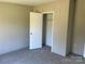 Bedroom featuring plush carpeting and a spacious closet, offering ample storage at 24257 Austin Rd, Albemarle, NC 28001
