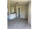 An open living room with modern gray carpet, built-in storage, and neutral wall colors at 24257 Austin Rd, Albemarle, NC 28001