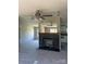 Cozy living room featuring a beautiful fireplace, ceiling fan, and neutral carpet at 24257 Austin Rd, Albemarle, NC 28001