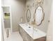 Elegant bathroom with double sinks, gold fixtures, decorative mirrors, and glass shower at 2A Riverlane Rd, Rock Hill, SC 29730
