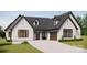 Beautiful white brick home featuring a three-car garage and well-manicured lawn at 2A Riverlane Rd, Rock Hill, SC 29730