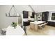 Modern kitchen featuring an island with seating, elegant lighting and black cabinets at 2A Riverlane Rd, Rock Hill, SC 29730