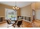 Bright dining area featuring large bay window and decorative wallpaper at 3196 Stonemill Path, Sherrills Ford, NC 28673