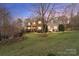 Charming two-story home with stone accents and a well-manicured lawn at 3196 Stonemill Path, Sherrills Ford, NC 28673