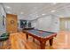 Spacious game room with a classic pool table, stylish bar stools, and a cozy living area at 3196 Stonemill Path, Sherrills Ford, NC 28673