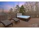 Relaxing outdoor hot tub with a scenic view of the surrounding trees at 3196 Stonemill Path, Sherrills Ford, NC 28673