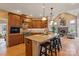 Modern kitchen featuring granite countertops, a center island, and an open view to the living room at 3196 Stonemill Path, Sherrills Ford, NC 28673