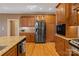 Spacious kitchen featuring stainless steel appliances, wooden cabinets, and granite countertops at 3196 Stonemill Path, Sherrills Ford, NC 28673