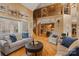 Open-concept living area with high ceilings, hardwood floors, and views to the kitchen and upper level at 3196 Stonemill Path, Sherrills Ford, NC 28673