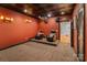 Cozy media room with theater seating, projector, and sconce lighting for an immersive experience at 3196 Stonemill Path, Sherrills Ford, NC 28673