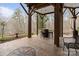 An inviting outdoor space featuring a barrel table, string lights, and beautiful views of the surrounding nature at 3196 Stonemill Path, Sherrills Ford, NC 28673