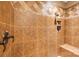 The tiled shower stall has a built in shelf, bronze fixtures, and a coordinated design at 3196 Stonemill Path, Sherrills Ford, NC 28673