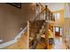 Elegant staircase with wrought iron railing leading to an open floor plan and kitchen at 3196 Stonemill Path, Sherrills Ford, NC 28673