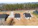 Aerial view of newly constructed homes with black shingles and wooded surroundings at 4029 Miller Rd, Salisbury, NC 28147