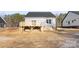 New construction home featuring a rear deck, gray siding, and a partially wooded lot at 4029 Miller Rd, Salisbury, NC 28147