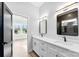 Bright bathroom featuring double vanity, modern lighting, and stylish mirrors at 4029 Miller Rd, Salisbury, NC 28147