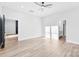 Spacious bedroom featuring hardwood floors, white walls, and a modern ceiling fan at 4029 Miller Rd, Salisbury, NC 28147