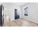 Bright bedroom featuring a window, closet, and light wood floors at 4029 Miller Rd, Salisbury, NC 28147