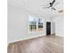 Inviting bedroom with large windows offering scenic views, ceiling fan, and modern lighting fixtures at 4029 Miller Rd, Salisbury, NC 28147