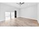 Bright bedroom with hardwood flooring, neutral walls, ceiling fan, and modern fixtures at 4029 Miller Rd, Salisbury, NC 28147