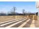 New deck with wooden rails and a view of the backyard at 4029 Miller Rd, Salisbury, NC 28147