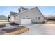 Modern home with a two car garage, concrete driveway, and light gray siding at 4029 Miller Rd, Salisbury, NC 28147