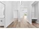 Bright foyer features neutral paint, trim and modern, light wood flooring at 4029 Miller Rd, Salisbury, NC 28147