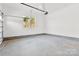 Large garage featuring concrete floors, and an automatic garage door opener at 4029 Miller Rd, Salisbury, NC 28147