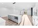 Spacious open kitchen with gray island, modern lighting, and wood-look floors at 4029 Miller Rd, Salisbury, NC 28147