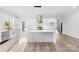 Bright kitchen with white cabinetry, stainless steel appliances, and large center island at 4029 Miller Rd, Salisbury, NC 28147