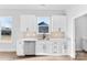 Kitchen sink area with white cabinets and stainless steel dishwasher at 4029 Miller Rd, Salisbury, NC 28147