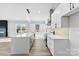Modern kitchen with white cabinets, stainless steel appliances, and a large island at 4029 Miller Rd, Salisbury, NC 28147