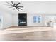 Bright open living area with modern fireplace, ceiling fan, and views of neighborhood at 4029 Miller Rd, Salisbury, NC 28147
