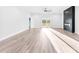 Spacious living room featuring wood-look floors, modern fireplace, and ample natural light at 4029 Miller Rd, Salisbury, NC 28147