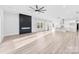 Bright open-plan living area featuring a modern fireplace and kitchen at 4029 Miller Rd, Salisbury, NC 28147