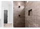 Contemporary shower with tiled walls, rainfall showerhead, and built-in shelving at 4029 Miller Rd, Salisbury, NC 28147