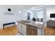 Kitchen island featuring stainless steel dishwasher and granite countertops at 404 N Laurel Ave # 12, Charlotte, NC 28204