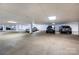 Well-lit parking garage with concrete floor and visible parking spaces at 404 N Laurel Ave # 12, Charlotte, NC 28204