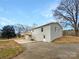 Spacious backyard featuring a wooden deck and brick exterior, perfect for outdoor entertaining at 510 Newport Dr, Salisbury, NC 28144