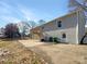 Backyard featuring a concrete patio, a deck, and a brick home exterior at 510 Newport Dr, Salisbury, NC 28144
