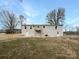 Expansive backyard with a wooden deck, set against a blue sky, offers ample outdoor space at 510 Newport Dr, Salisbury, NC 28144
