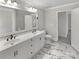 Bathroom featuring a dual sink vanity with marble flooring, a toilet, and a large mirror at 510 Newport Dr, Salisbury, NC 28144