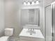 Updated bathroom with a white vanity, modern fixtures, and a large mirror at 510 Newport Dr, Salisbury, NC 28144