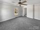 Spacious bedroom with carpeted floors, a ceiling fan, and a window for natural light at 510 Newport Dr, Salisbury, NC 28144