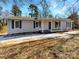 Charming single-story home featuring a covered front porch and freshly painted exterior with navy blue shutters at 510 Newport Dr, Salisbury, NC 28144