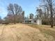 Charming single story home with a beautifully landscaped front yard on a clear day at 510 Newport Dr, Salisbury, NC 28144