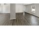 Open-concept living room with hardwood flooring, neutral paint, and natural light at 510 Newport Dr, Salisbury, NC 28144