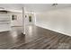 Bright living room featuring light grey walls, modern ceiling fan and luxury vinyl plank flooring at 510 Newport Dr, Salisbury, NC 28144